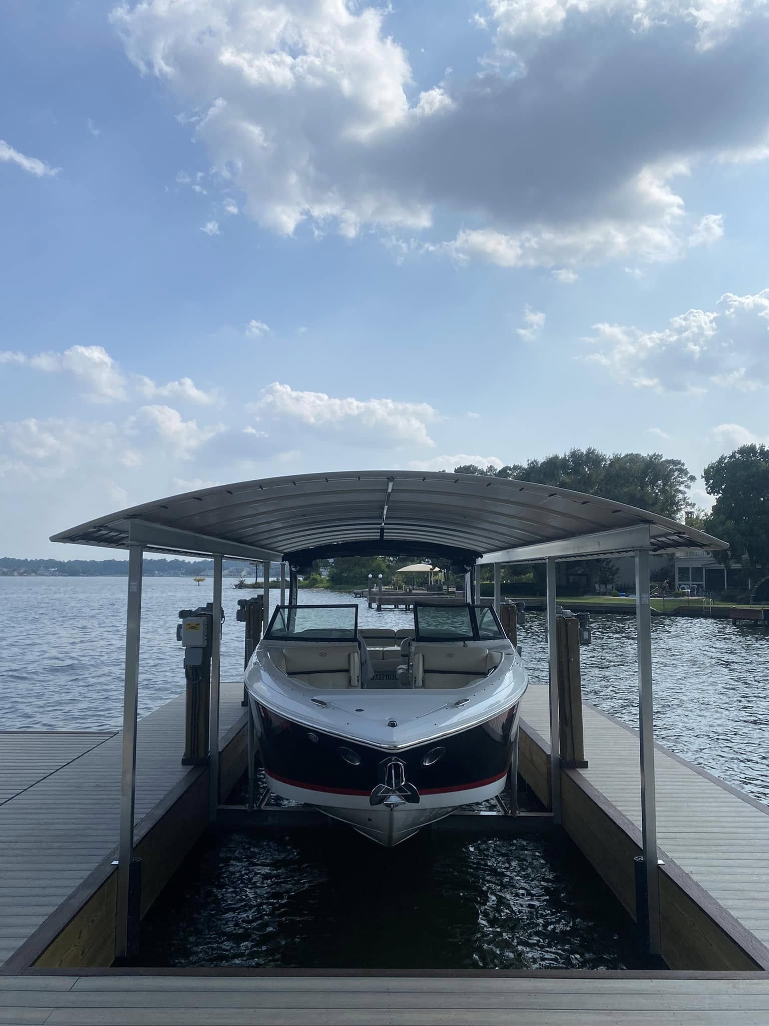 Boat Lift Installation on Lake Conroe 1 boat lift installation Lake Conroe — covered boat slip aluminum canopy cable lift