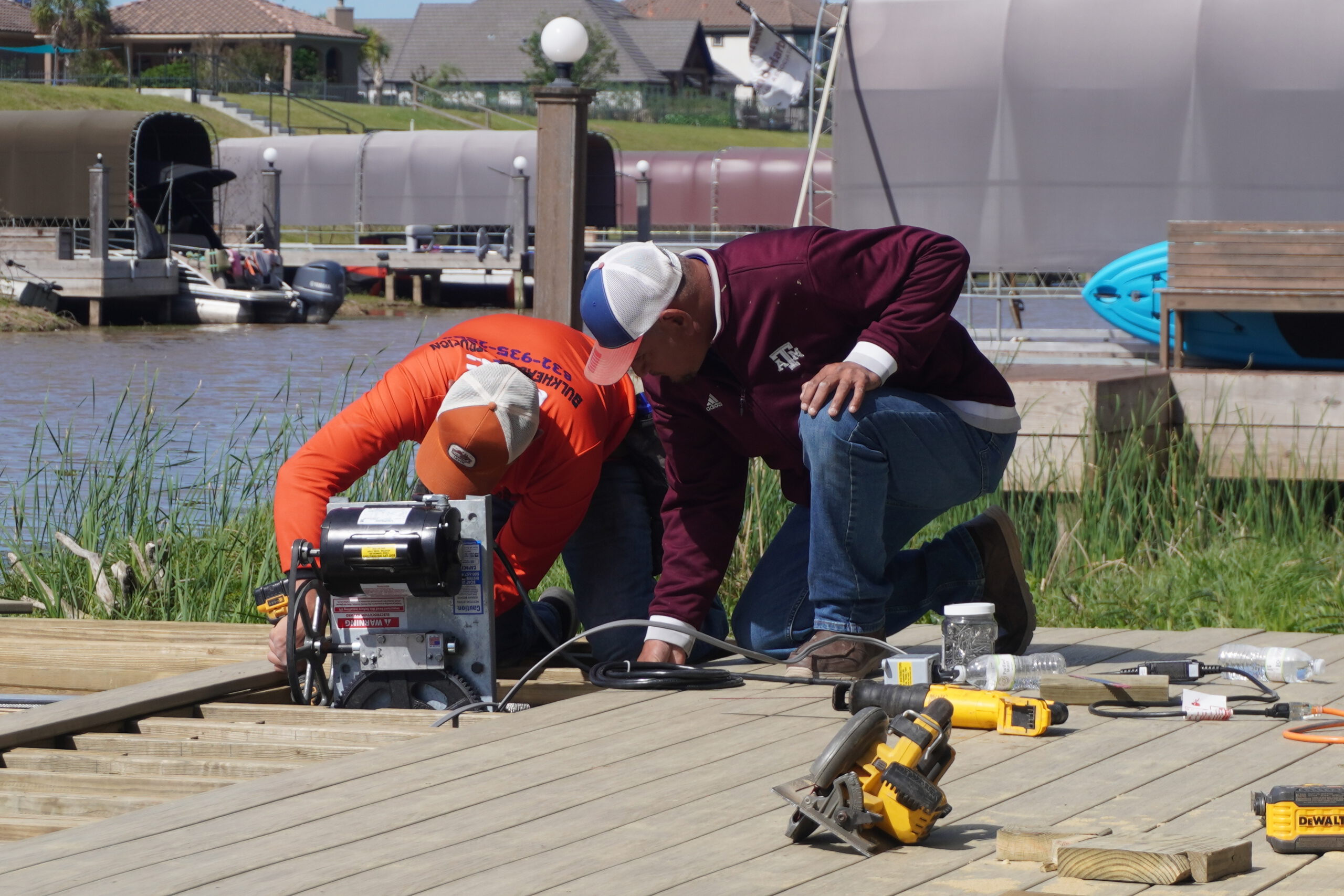 Dock Repair Services on Lake Conroe 1 dock repair Lake Conroe — crew installing dock boards close up
