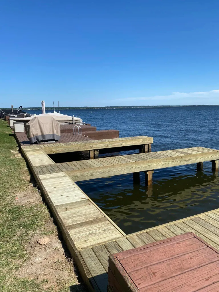 Pier Construction on Lake Conroe & Lake Livingston 1 pier construction Lake Conroe — new wood dock L-shape on lake