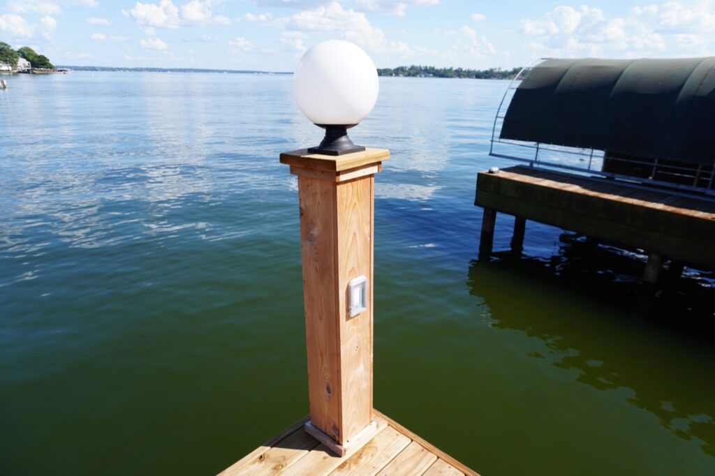 Dock Light Posts on Lake Conroe 1 Globe light fixture on a dock light post overlooking Lake Conroe