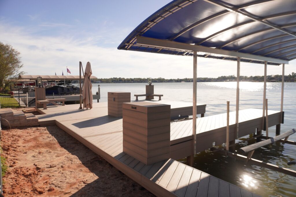 Raised Motor Boxes on Lake Conroe 2 Raised motor boxes on a composite dock next to a covered boathouse on Lake Conroe